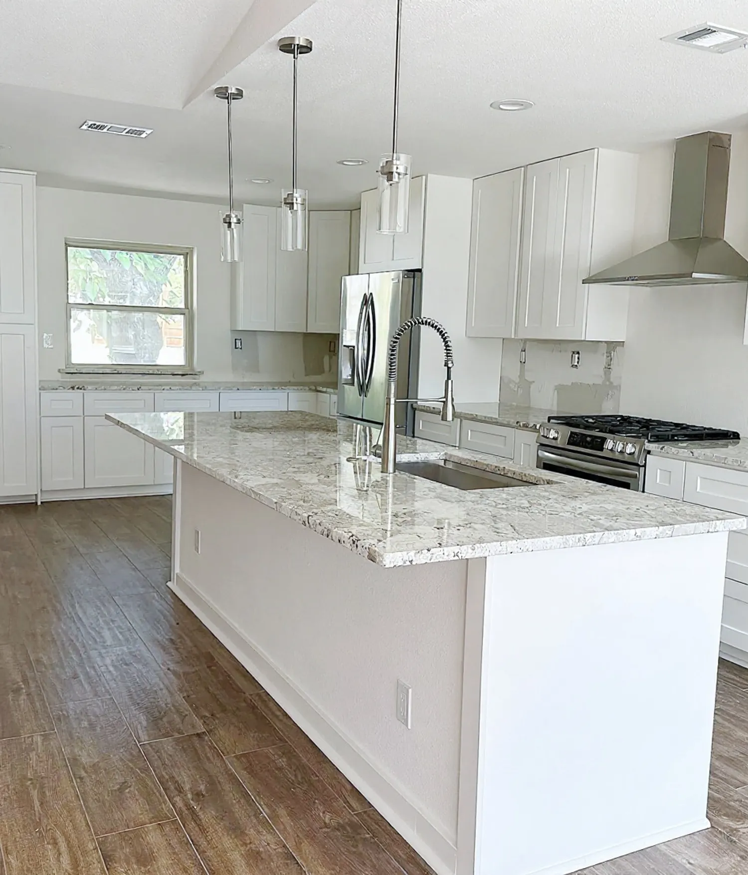 Open-concept whole-home remodel in the Dallas area with a custom kitchen at its center