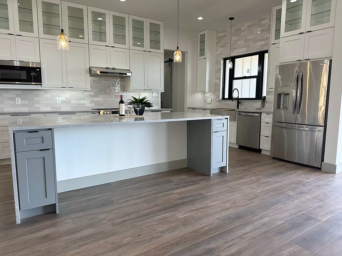 Luxury kitchen with a quartz island and glass-front cabinetry