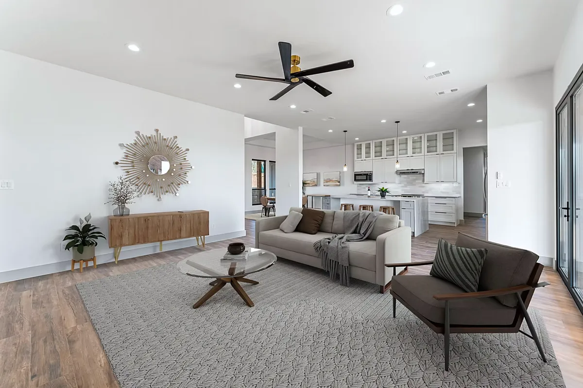 Open great room with a custom kitchen beyond